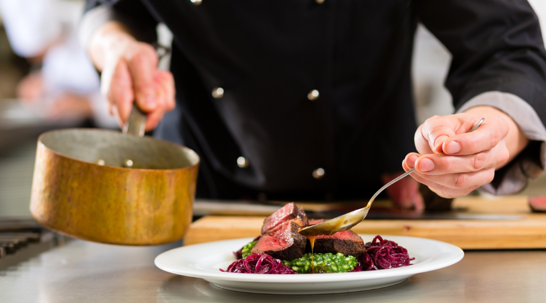 cook plating an elegant dish